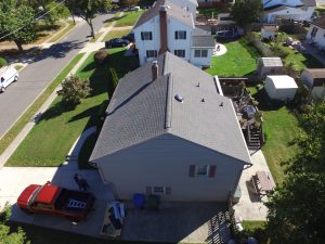 View from above a home with an asphalt shingle roofing system